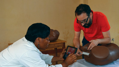 PHR consultant Georges Kuzma and Panzi Hospital’s Dr. Nadine Neema Rukunghu test a forensic documentation app.