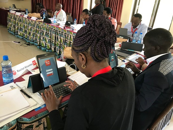 Kenyan health professionals learning to use MediCapt at a PHR training.