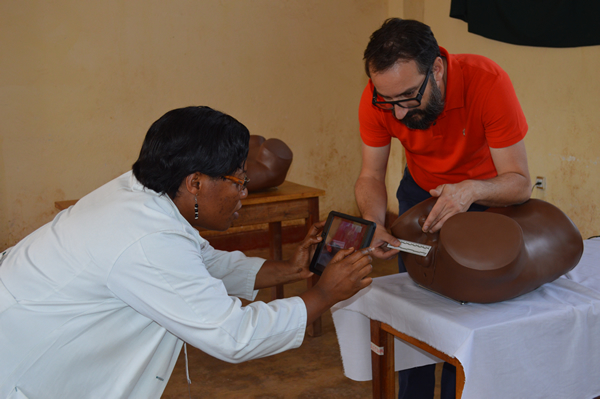 PHR partner Dr. Nadine Neema Rukunghu of the DRC’s Panzi Hospital and PHR consultant Georges Kuzma test MediCapt’s secure capture feature for forensic photography.