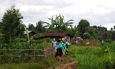 Women walk through the village of Kavumu in the Democratic Republic of the Congo. | PHR Photo