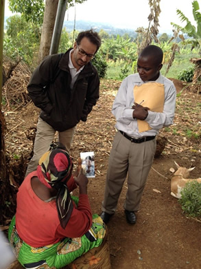 PHR legal and justice expert Georges Kuzma and a police investigator interview a Kavumu resident about alleged perpetrators. | PHR Photo